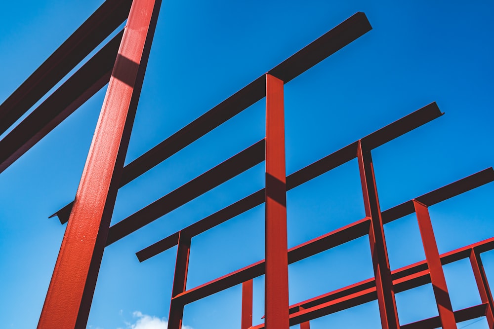 a red metal structure against a blue sky