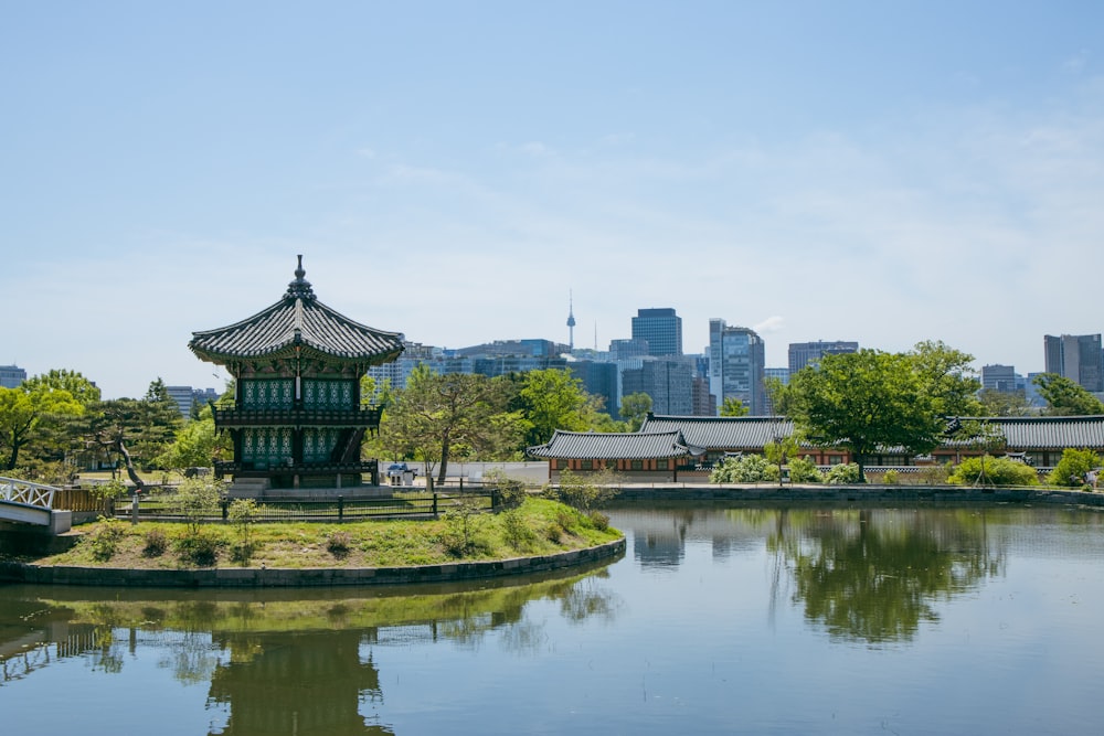 a large body of water with a building in the background