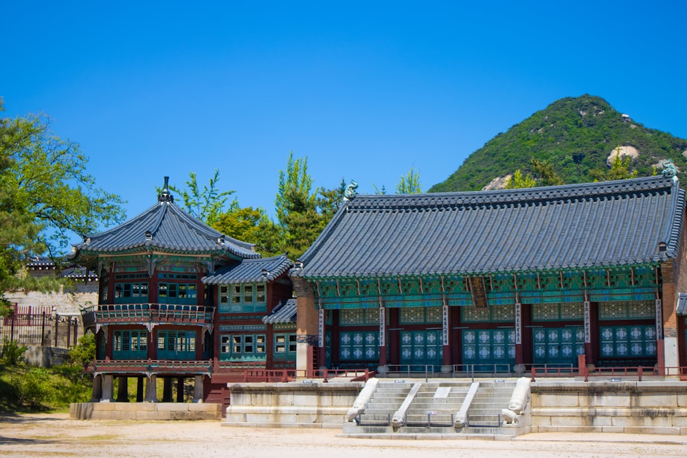 a building with a mountain in the background