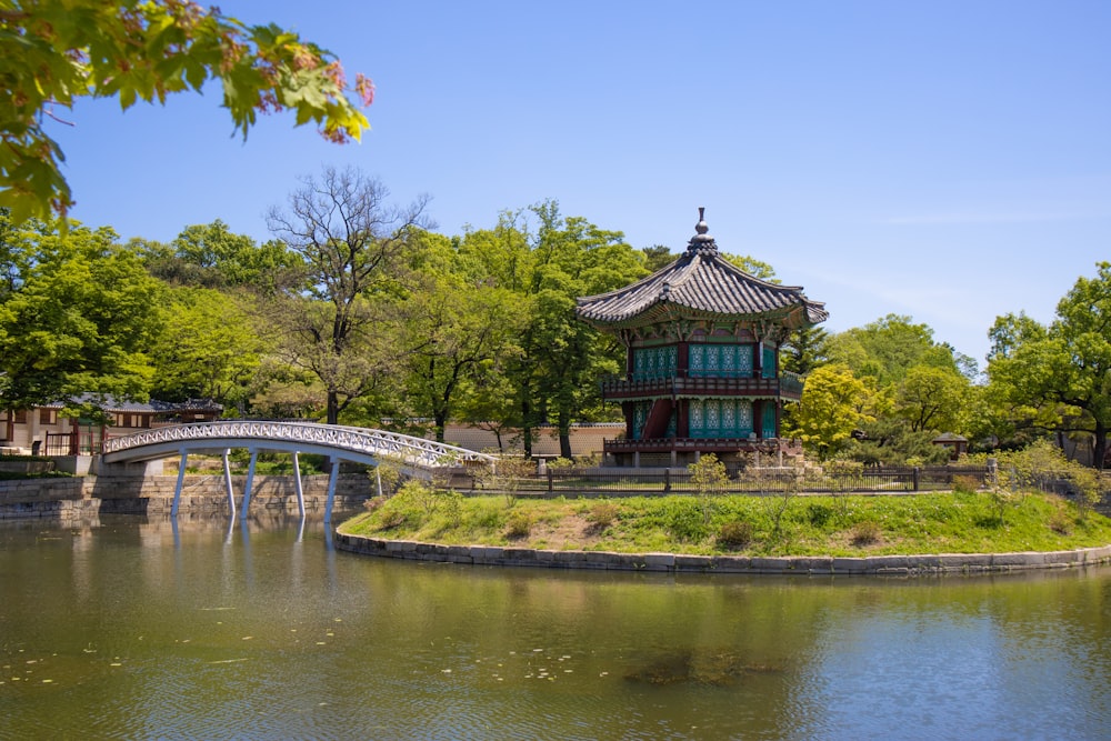 a bridge crossing over a river in a park