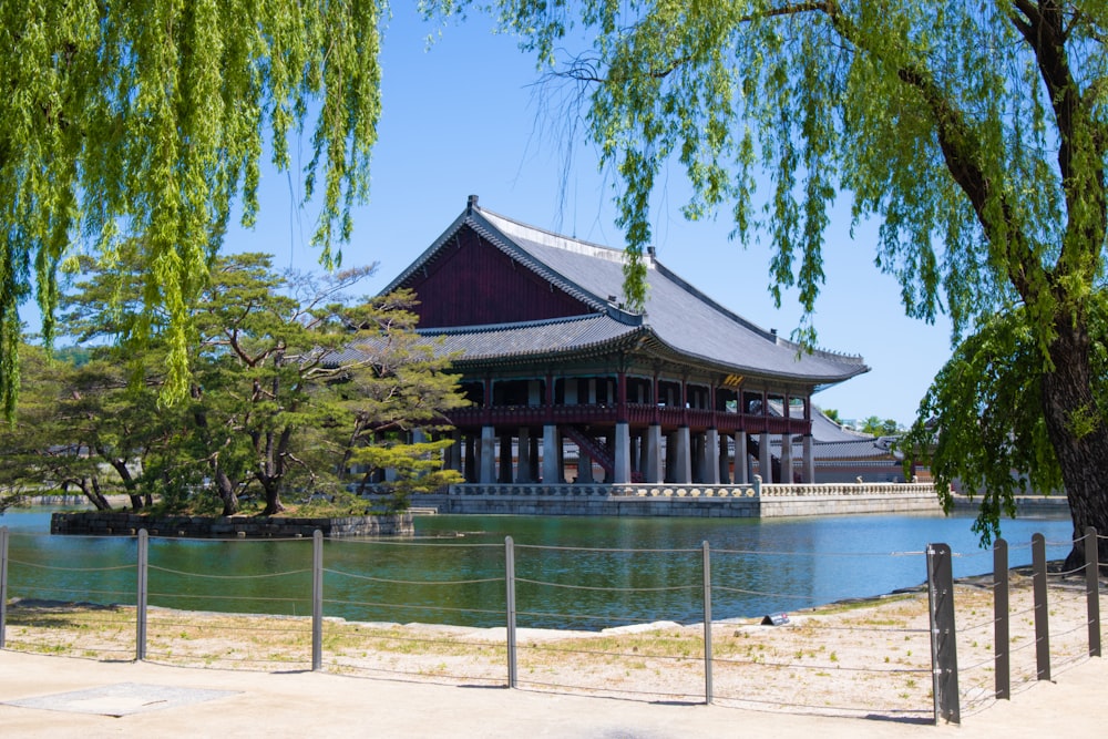 a large building sitting next to a body of water