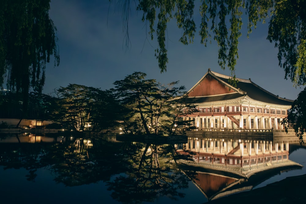 a reflection of a building in a body of water