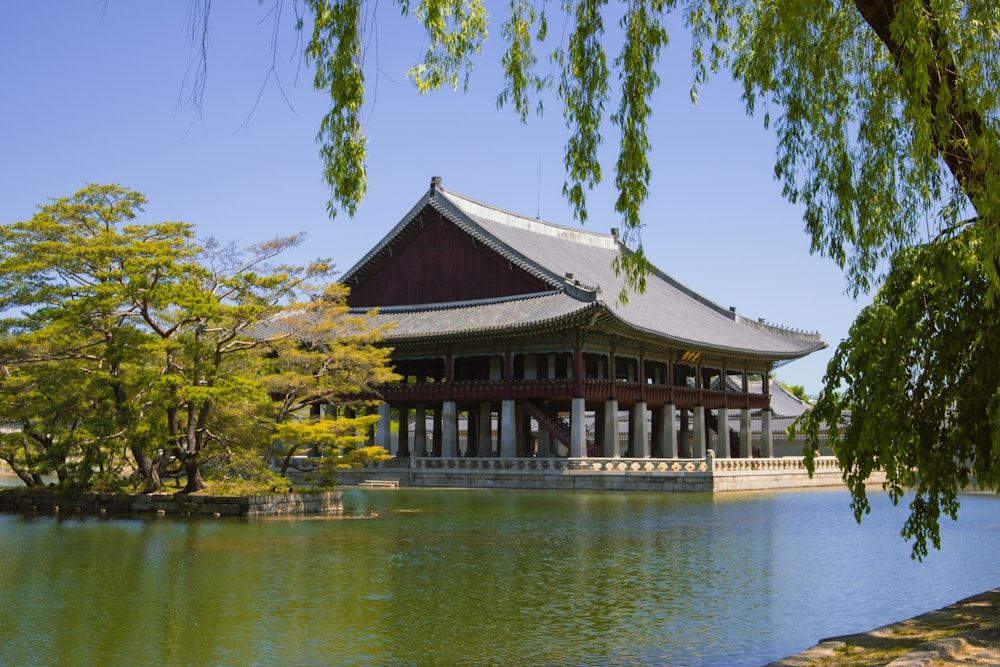 a large building sitting next to a body of water