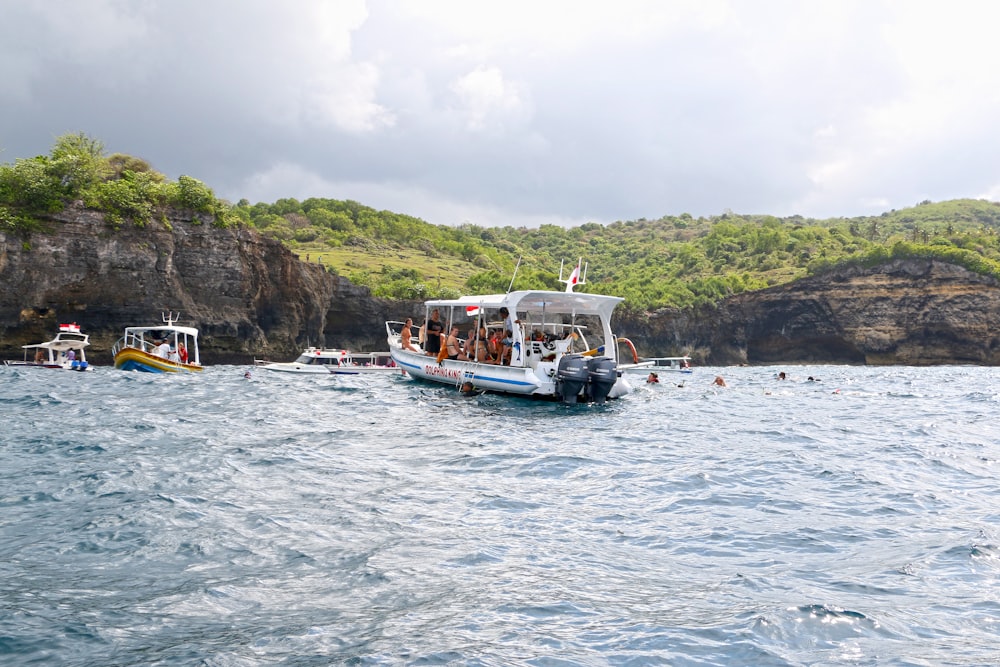 a group of people on a boat in the water