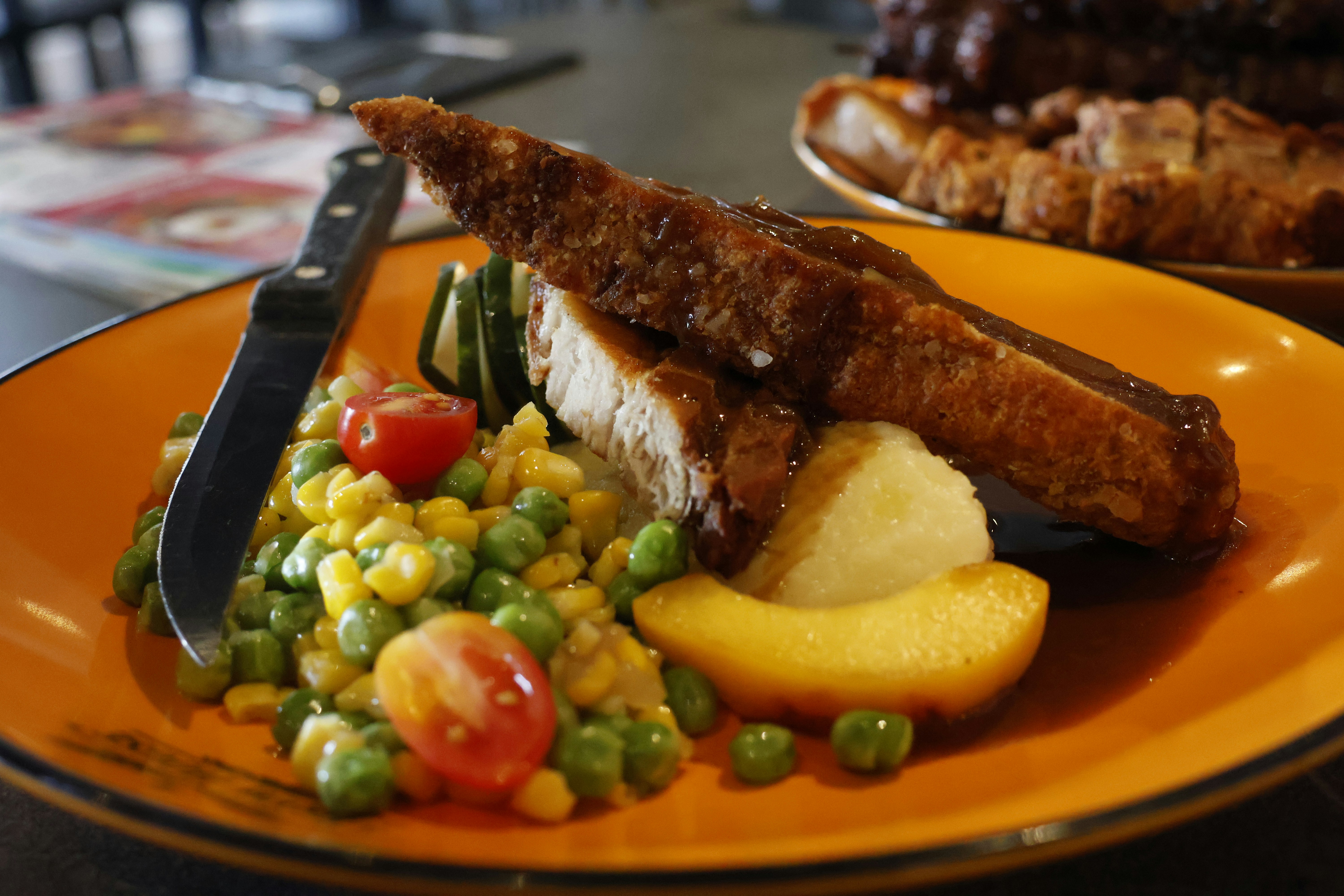 Homestyle meatloaf slice with creamy mashed potatoes and rich brown gravy