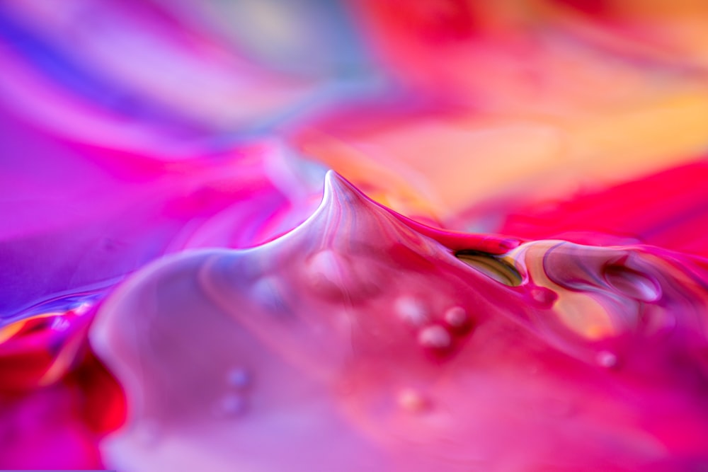 a close up of a colorful liquid substance