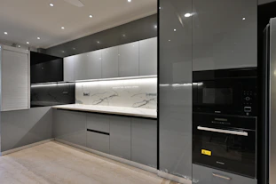 a modern kitchen with a marble counter top