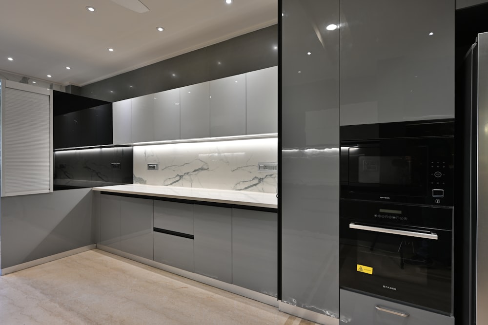 a modern kitchen with a marble counter top