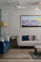 Elegant living room with blue and white decor, showcasing a premium property.