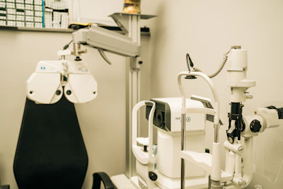 a medical room with a microscope and other equipment