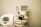a white toilet with a monitor on top of it
