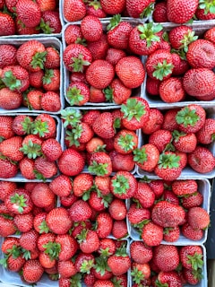 Close-up of freshly picked strawberries in a basket.