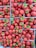 A vibrant display of fresh strawberries and blueberries in a basket.