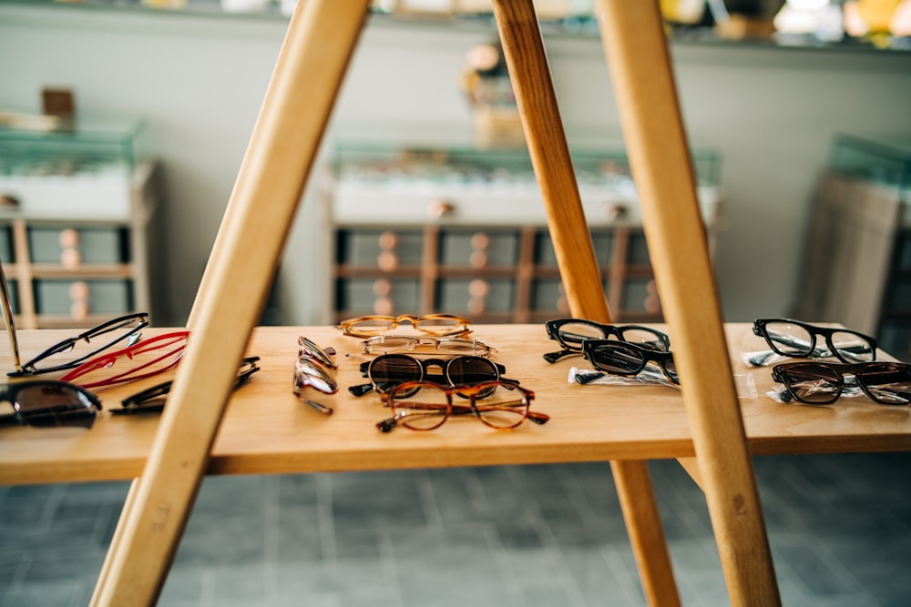 a wooden table topped with lots of glasses