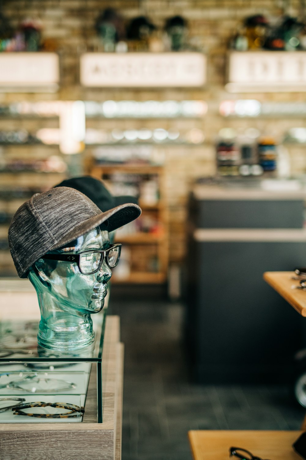 a hat and glasses on display in a store