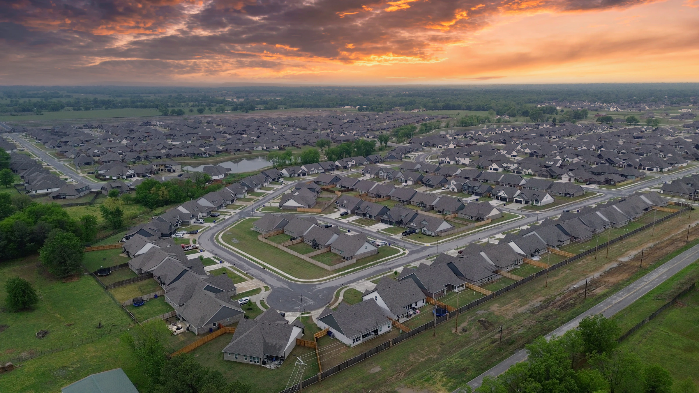 Aerial view of a new build-to-rent community at sunset