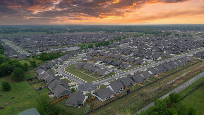 Aerial view of a suburban neighborhood at sunset, similar to the southwest Las Vegas homes inside the Desert Oasis High School panhandle under review