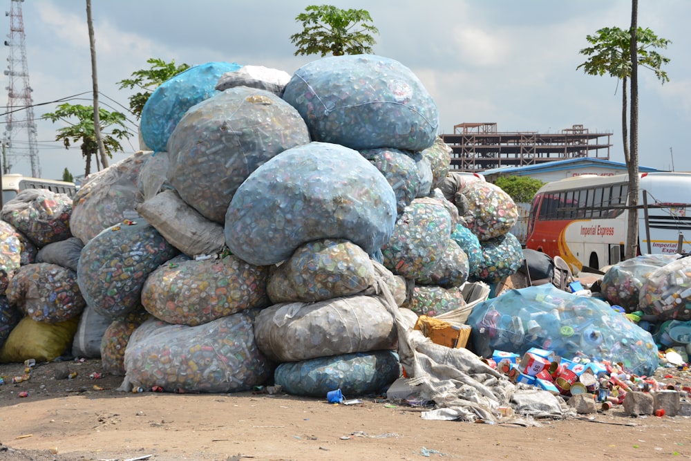 a pile of garbage sitting next to a bus