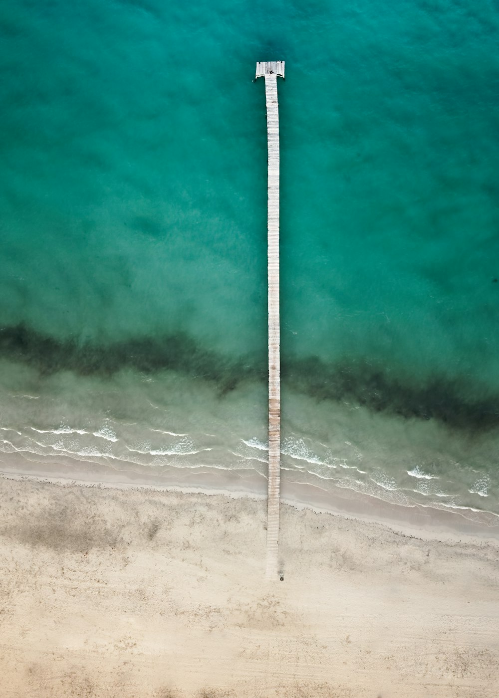 an aerial view of a beach and ocean