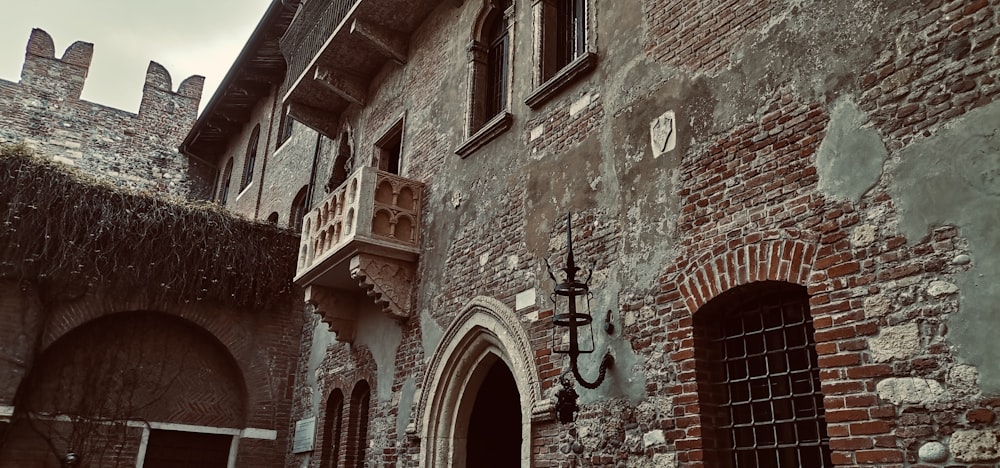 an old building with a clock on the side of it