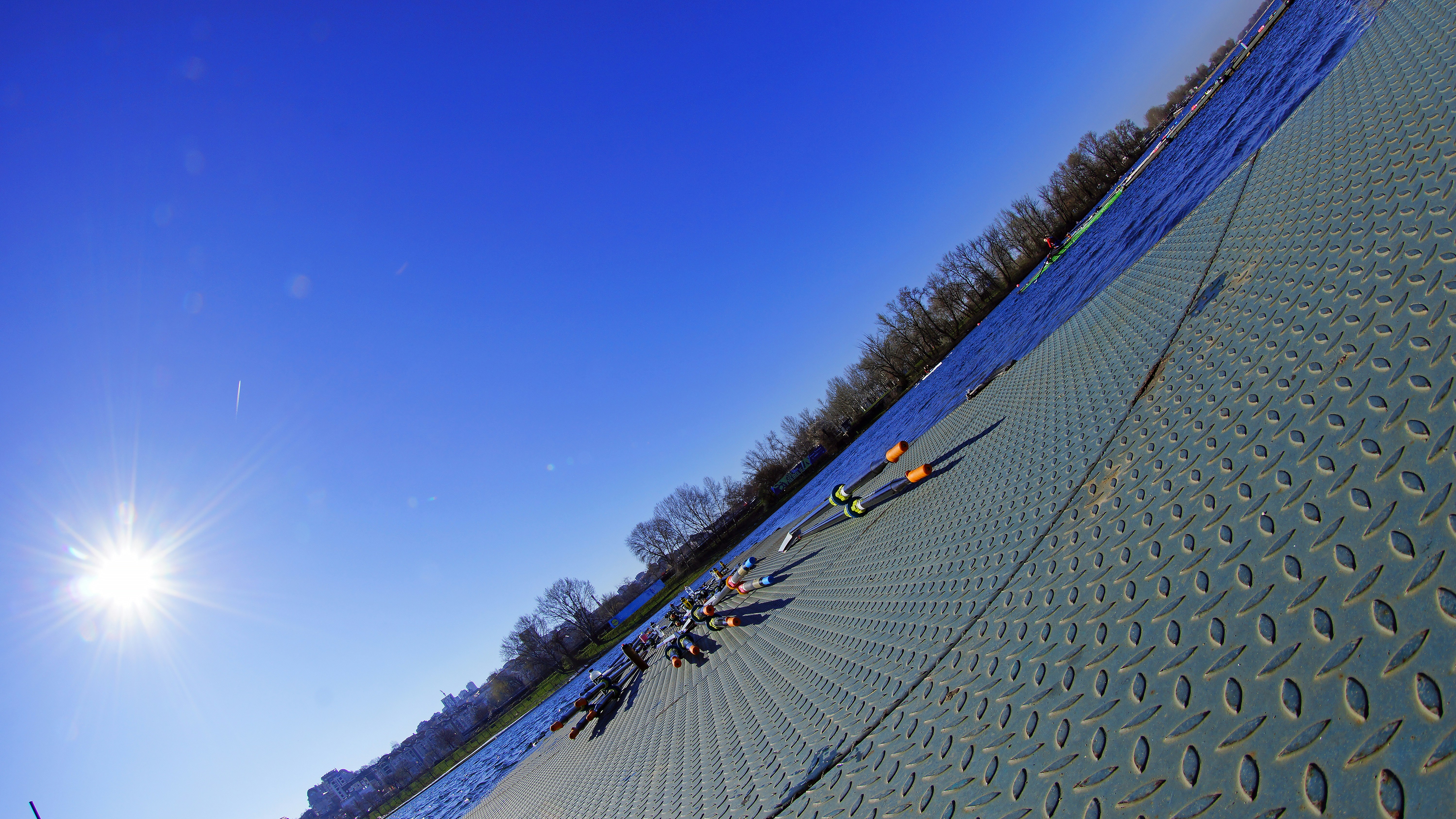 the sun is shining on the snow covered ground