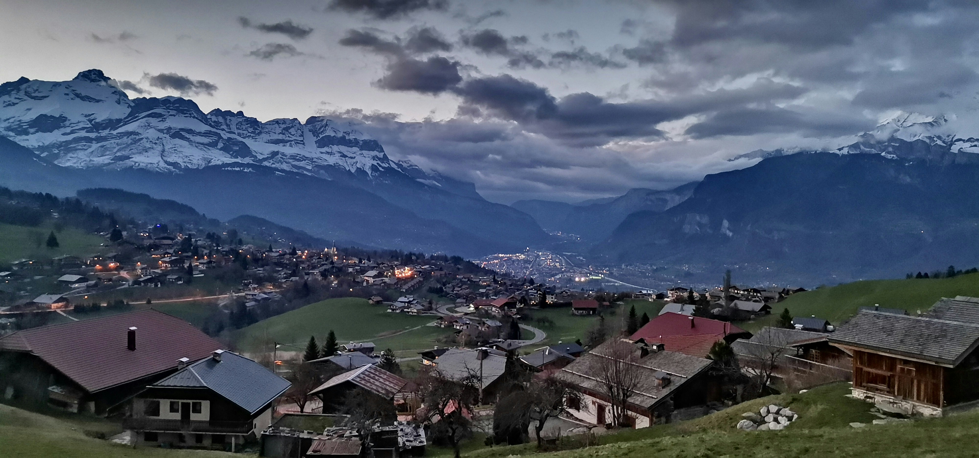 a view of a village in the mountains