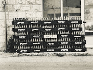 Stacks of elegant maqwave bottled water ready for wholesale distribution in a warehouse.