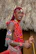 Close-up of a man proudly wearing a zimara shirt with traditional Zimbabwean motifs.