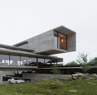 a car is parked in front of a modern house