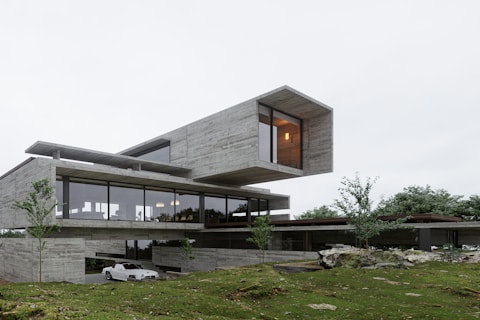 a car is parked in front of a modern house