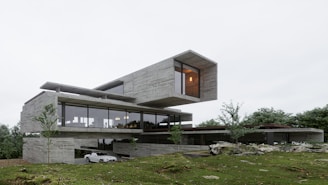 a car is parked in front of a modern house