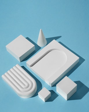 a set of white objects on a blue surface