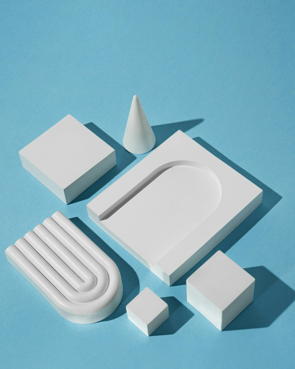 a set of white objects on a blue surface