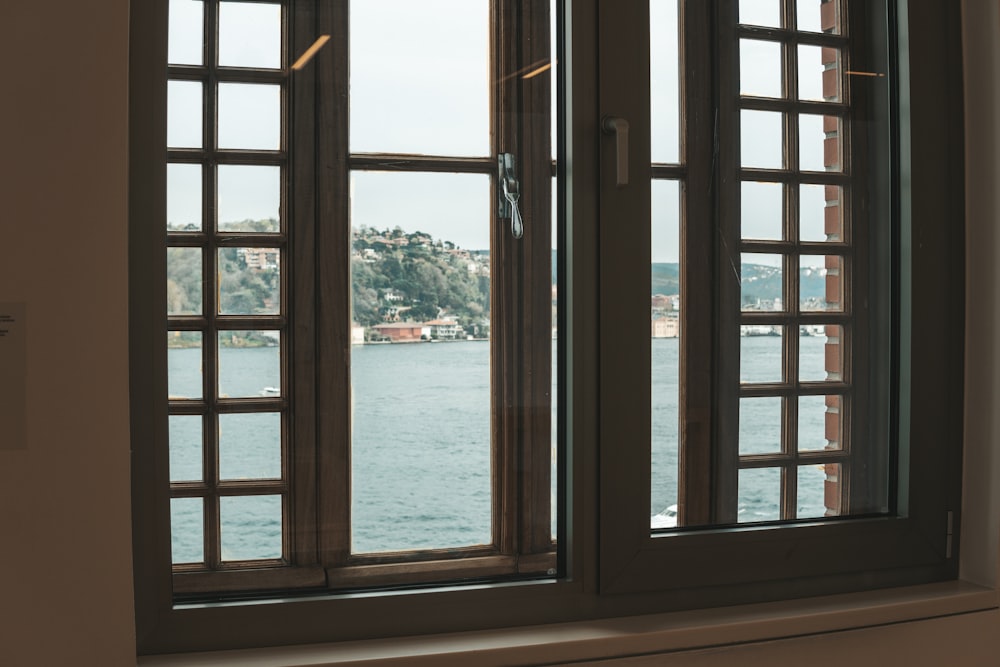 a window with a view of a body of water