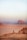 a person standing on top of a sandy hill