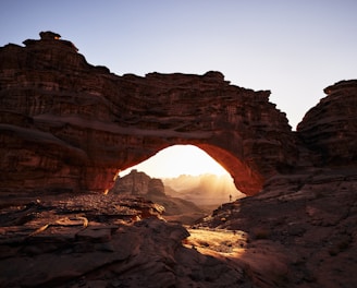 a large rock formation with a small hole in the middle of it