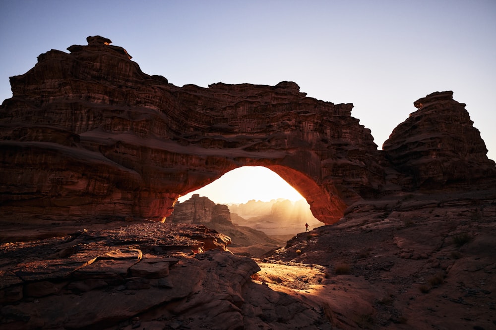 a large rock formation with a small hole in the middle of it