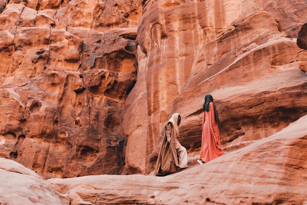 a couple of people that are standing in the dirt