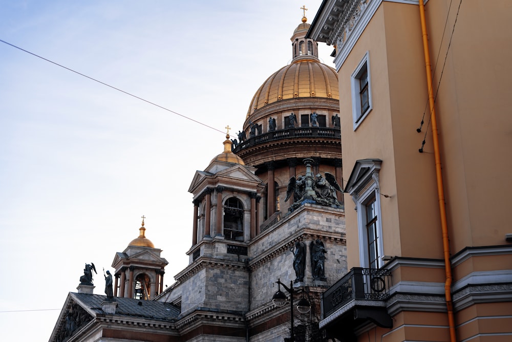 a tall building with a golden dome on top