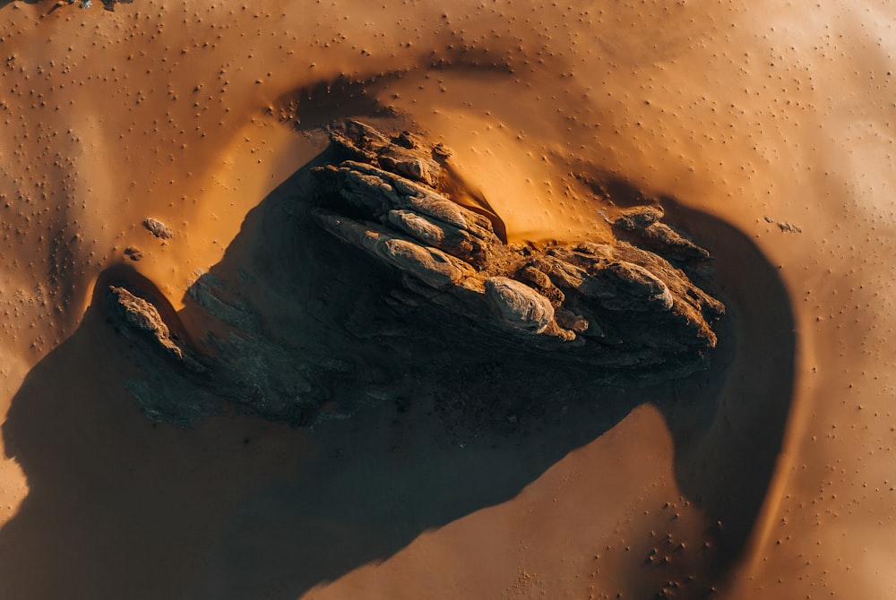 an aerial view of a rock formation in the desert