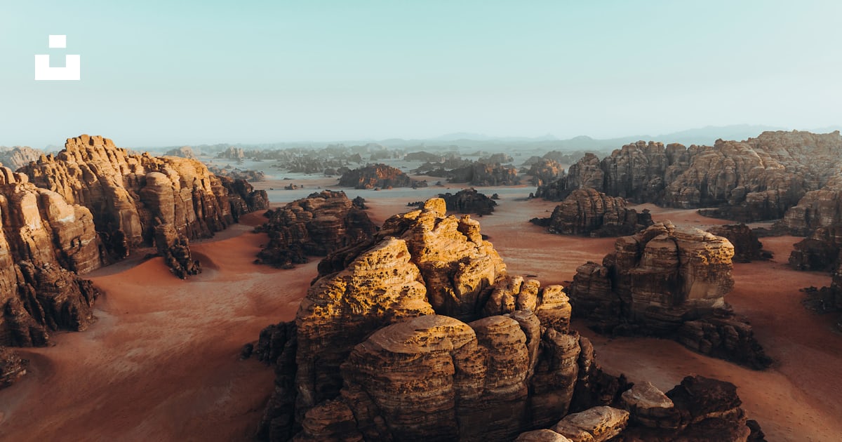An aerial view of a desert with rocks and sand photo – Free Hisma ...