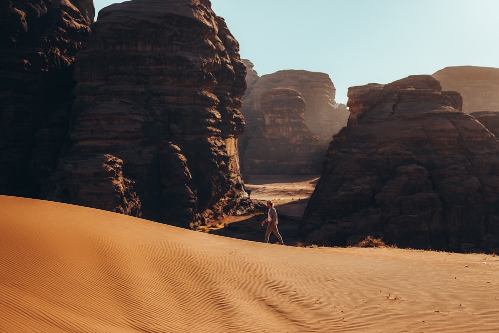 a person standing in the middle of a desert