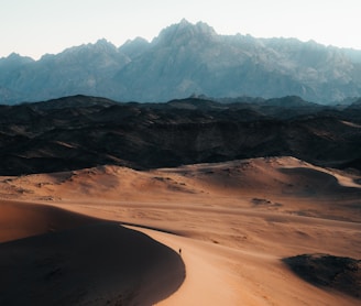 a view of a mountain range in the desert