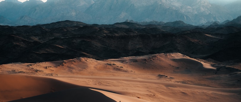 a view of a mountain range in the desert