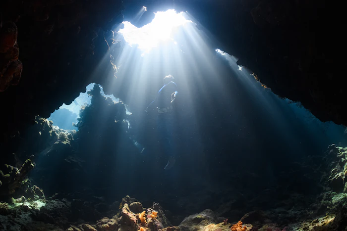 Sunbeam shining through a sea cave, similar to Thunderball Grotto