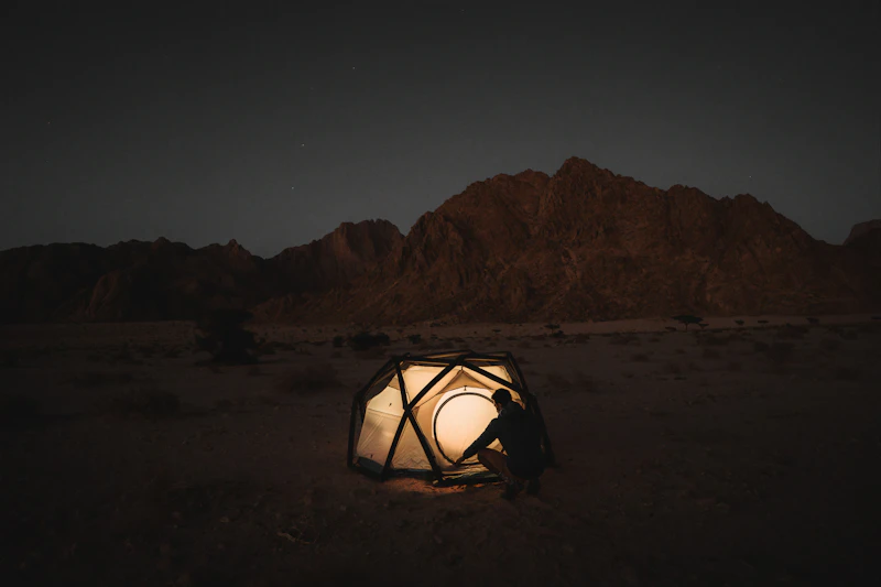 Glowing dome tent interior desert night Morocco