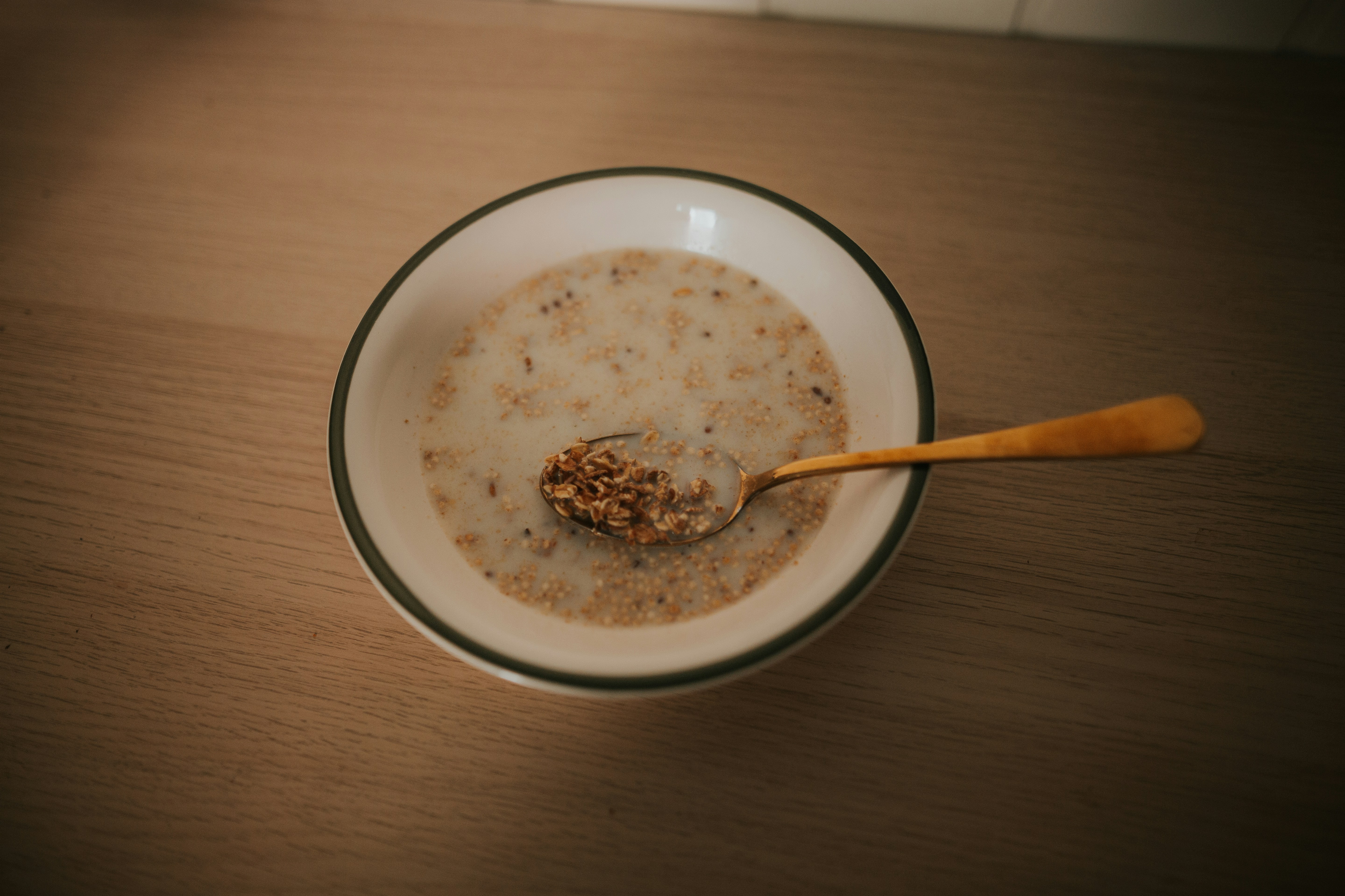 a bowl of oatmeal with a spoon in it