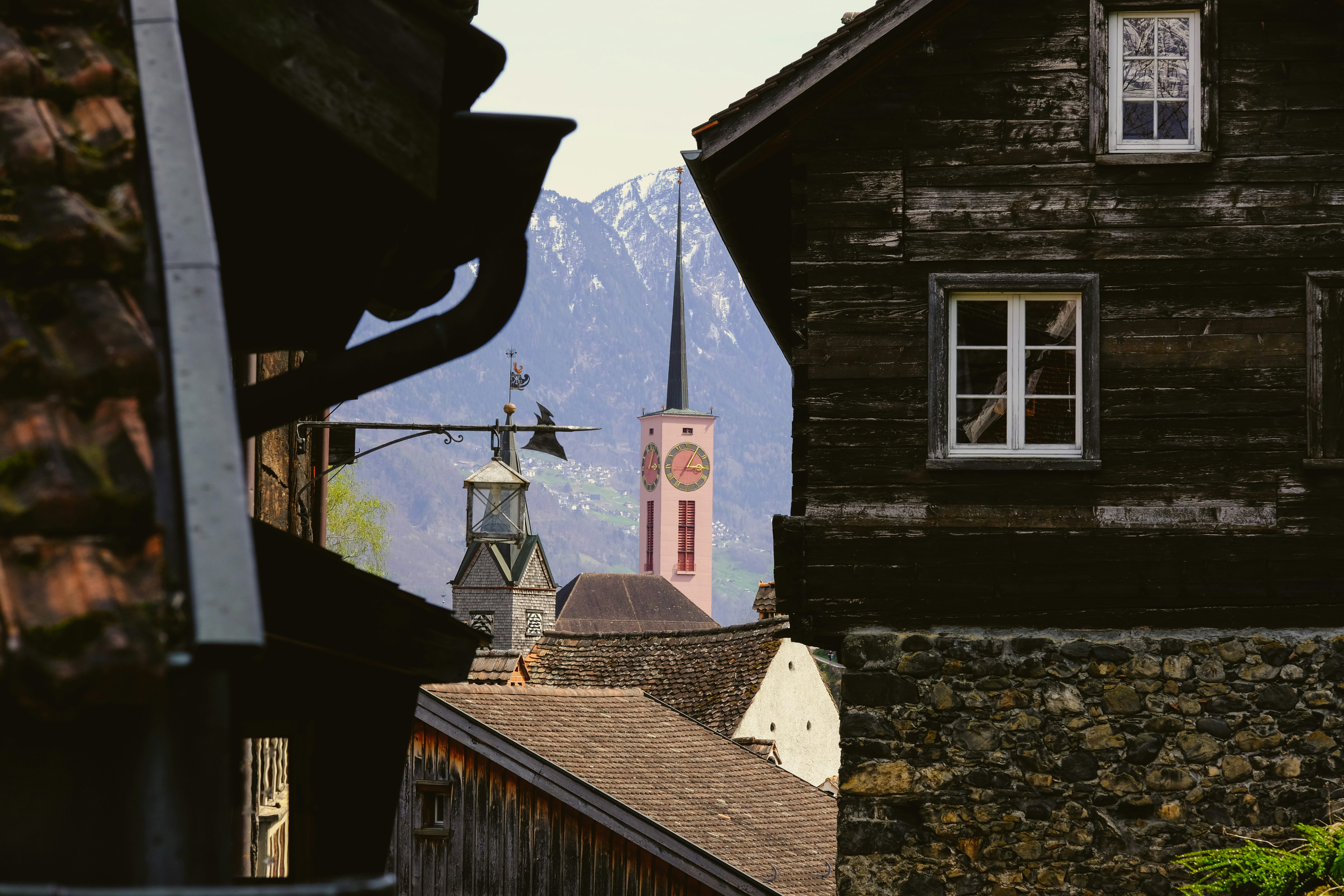 a view of a building with a clock tower in the background