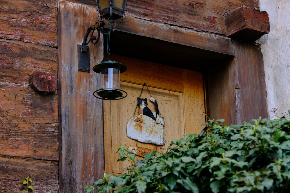 a lamp hanging from the side of a building