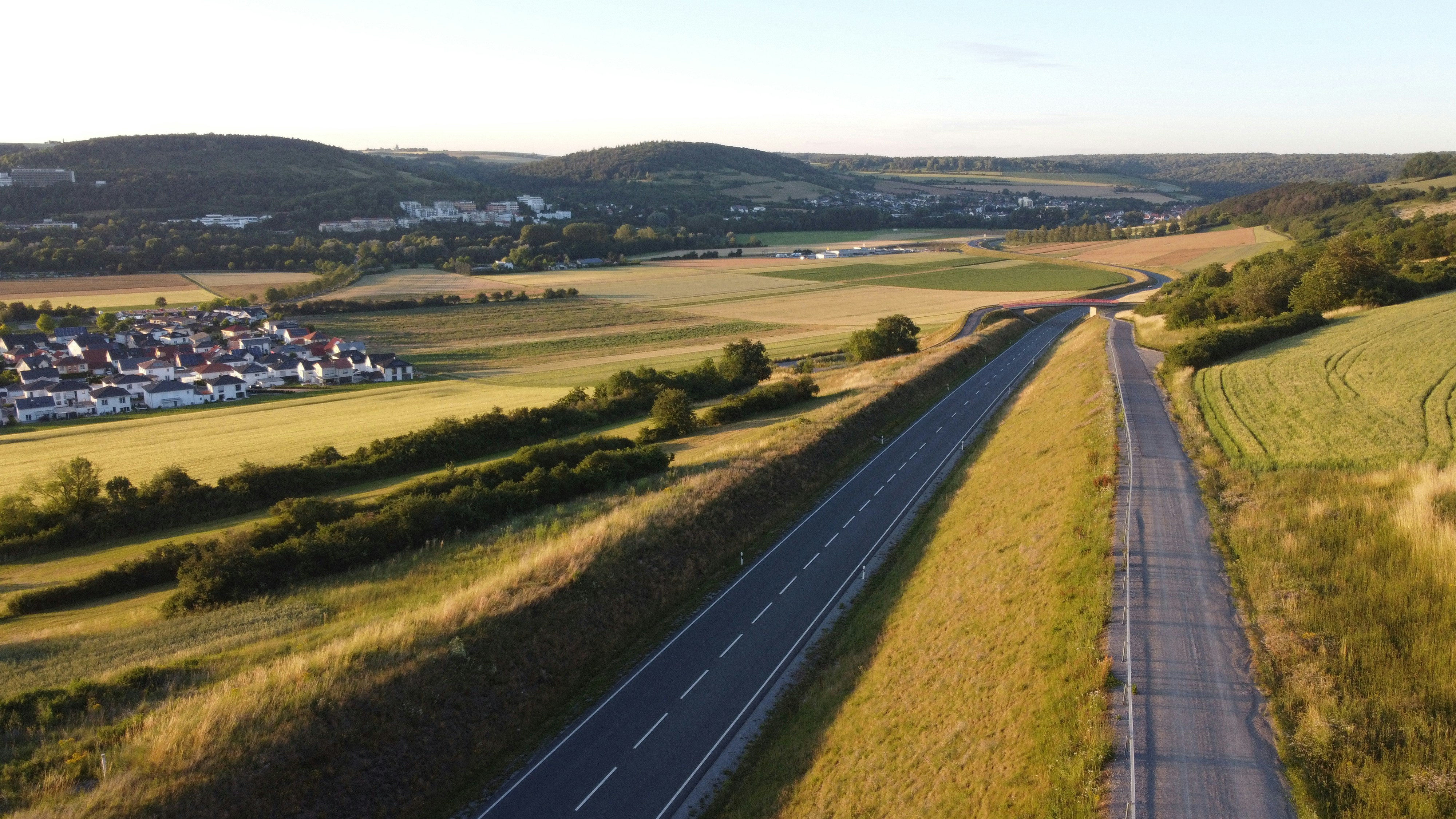 An aerial view of a road in a rural area photo – Free Trees Image on ...